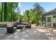 Wooden back deck with patio furniture, perfect for relaxation, with an entrance to a screened in porch at 4013 Dover Ave, Alpharetta, GA 30009
