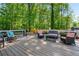 Spacious back deck is equipped with comfortable seating, a table, and scenic views of the yard at 4013 Dover Ave, Alpharetta, GA 30009