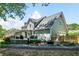 Lush backyard featuring an entertainment deck, screened in porch, and mature plantings at 4013 Dover Ave, Alpharetta, GA 30009