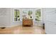 Bright dining area with hardwood floors and large windows for natural light at 4013 Dover Ave, Alpharetta, GA 30009