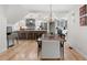Bright dining room features a wooden table with seating for eight and an open view to the kitchen at 4013 Dover Ave, Alpharetta, GA 30009
