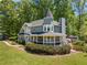 Charming two-story home with a turret, covered front porch, and beautifully landscaped front yard at 4013 Dover Ave, Alpharetta, GA 30009