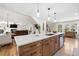 Open concept kitchen features a center island, stainless steel appliances, and seamless flow into the living area at 4013 Dover Ave, Alpharetta, GA 30009