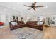 Open concept living room showcases hardwood floors, recessed lighting, and a large sectional sofa at 4013 Dover Ave, Alpharetta, GA 30009