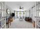 Inviting living room with a neutral color palette, bay windows, modern furnishings and plenty of natural light at 4013 Dover Ave, Alpharetta, GA 30009