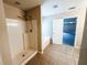Bathroom featuring a tub/shower combo and tile flooring at 5584 Dendy Trce, Fairburn, GA 30213