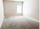 Bedroom with neutral walls, carpet, and a window at 5584 Dendy Trce, Fairburn, GA 30213