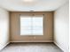 Bedroom with neutral walls, carpet, and a window at 5584 Dendy Trce, Fairburn, GA 30213