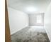 This carpeted bedroom features a window, providing natural light and a cozy atmosphere at 5584 Dendy Trce, Fairburn, GA 30213