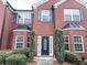Close-up of the front entrance featuring brick facade and a decorative front door at 5584 Dendy Trce, Fairburn, GA 30213