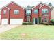 Charming two-story brick home featuring a well-manicured lawn and inviting curb appeal at 5584 Dendy Trce, Fairburn, GA 30213