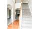 Bright foyer featuring hardwood floors and a staircase leading to the upper level at 5584 Dendy Trce, Fairburn, GA 30213