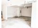 Clean, spacious two-car garage with white walls and ample storage space at 5584 Dendy Trce, Fairburn, GA 30213