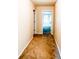 Hallway leading to carpeted bedrooms with natural light provides great flow at 5584 Dendy Trce, Fairburn, GA 30213