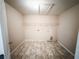 Laundry room with tile flooring and some shelving at 5584 Dendy Trce, Fairburn, GA 30213