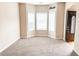 Cozy living room with a bay window, offering a relaxing space to unwind at 5584 Dendy Trce, Fairburn, GA 30213