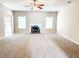 Spacious living room showcasing a fireplace and ample natural light at 5584 Dendy Trce, Fairburn, GA 30213