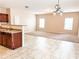 Bright living room features neutral walls, carpet, and tile floors at 5584 Dendy Trce, Fairburn, GA 30213