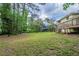 Spacious backyard, mature trees, and a well-maintained lawn at 8431 Magnolia Dr, Jonesboro, GA 30238