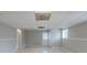 Unfinished basement with tiled floor, walkout exit, and ample space for storage or customization at 8431 Magnolia Dr, Jonesboro, GA 30238