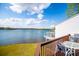 Enjoy outdoor lake views from the backyard deck with a dining area and stainless steel grill at 277 Clearview Ct, Villa Rica, GA 30180