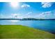 This backyard features green grass and a lake view at 277 Clearview Ct, Villa Rica, GA 30180