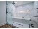 Modern bathroom featuring a glass enclosed shower and built-in bathtub at 277 Clearview Ct, Villa Rica, GA 30180