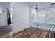 Modern bathroom featuring a large, glass-enclosed shower with marble-style tiling at 277 Clearview Ct, Villa Rica, GA 30180