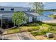 Waterfront condo with a sandy beach area and a well-maintained lawn at 277 Clearview Ct, Villa Rica, GA 30180