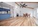 This living room features hardwood floors, a large ceiling fan, and an open kitchen at 277 Clearview Ct, Villa Rica, GA 30180