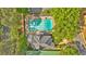 Aerial photograph of a community pool, pool house, and tennis courts at 3265 Belmont Glen Se Dr, Marietta, GA 30067