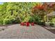 Secluded backyard with a pergola, mature trees, and a relaxing outdoor seating area at 3265 Belmont Glen Se Dr, Marietta, GA 30067