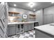 Wet bar features ample storage, wine cooler, and a stylish design perfect for entertaining guests at 3265 Belmont Glen Se Dr, Marietta, GA 30067