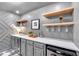 Close-up view of wet bar featuring ample storage, wine cooler, and modern design at 3265 Belmont Glen Se Dr, Marietta, GA 30067