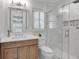 Bathroom with a stylish wooden vanity, a clear glass shower, and a tiled shower wall at 3265 Belmont Glen Se Dr, Marietta, GA 30067