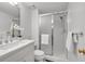 Bright bathroom features a glass shower, white vanity, and minimalist decor at 3265 Belmont Glen Se Dr, Marietta, GA 30067