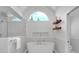 Bright bathroom featuring a soaking tub, glass-enclosed shower, and modern fixtures at 3265 Belmont Glen Se Dr, Marietta, GA 30067