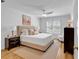 A primary bedroom featuring hardwood floors, a ceiling fan, and natural light at 3265 Belmont Glen Se Dr, Marietta, GA 30067