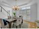 Dining room featuring modern light fixture, table and seating for six at 3265 Belmont Glen Se Dr, Marietta, GA 30067