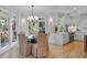 Bright dining area adjacent to the kitchen, featuring large windows and a chandelier at 3265 Belmont Glen Se Dr, Marietta, GA 30067