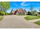 Beautiful red brick home with well-kept lawn and long driveway at 3265 Belmont Glen Se Dr, Marietta, GA 30067