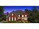 Stately red brick home with manicured landscaping and classic architectural details at 3265 Belmont Glen Se Dr, Marietta, GA 30067