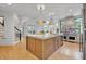 Open kitchen featuring a large island, stainless steel appliances, and modern pendant lights at 3265 Belmont Glen Se Dr, Marietta, GA 30067