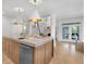 Modern kitchen with a large island, hardwood floors, and stainless steel appliances at 3265 Belmont Glen Se Dr, Marietta, GA 30067