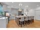 Open kitchen featuring an island with barstools, modern finishes, and ample counter space at 3265 Belmont Glen Se Dr, Marietta, GA 30067
