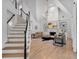Bright living room with hardwood floors, fireplace, and staircase at 3265 Belmont Glen Se Dr, Marietta, GA 30067