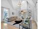 Bright living room featuring a vaulted ceiling, fireplace, and hardwood floors at 3265 Belmont Glen Se Dr, Marietta, GA 30067