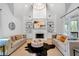 Bright living room featuring a vaulted ceiling, fireplace, and hardwood floors at 3265 Belmont Glen Se Dr, Marietta, GA 30067