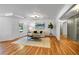 Bright living room showcasing hardwood floors, recessed lighting, and a stylish, modern chandelier at 3265 Belmont Glen Se Dr, Marietta, GA 30067