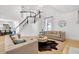 Bright living room featuring a staircase, hardwood floors, and neutral decor at 3265 Belmont Glen Se Dr, Marietta, GA 30067